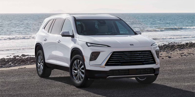 White Buick SUV by the ocean